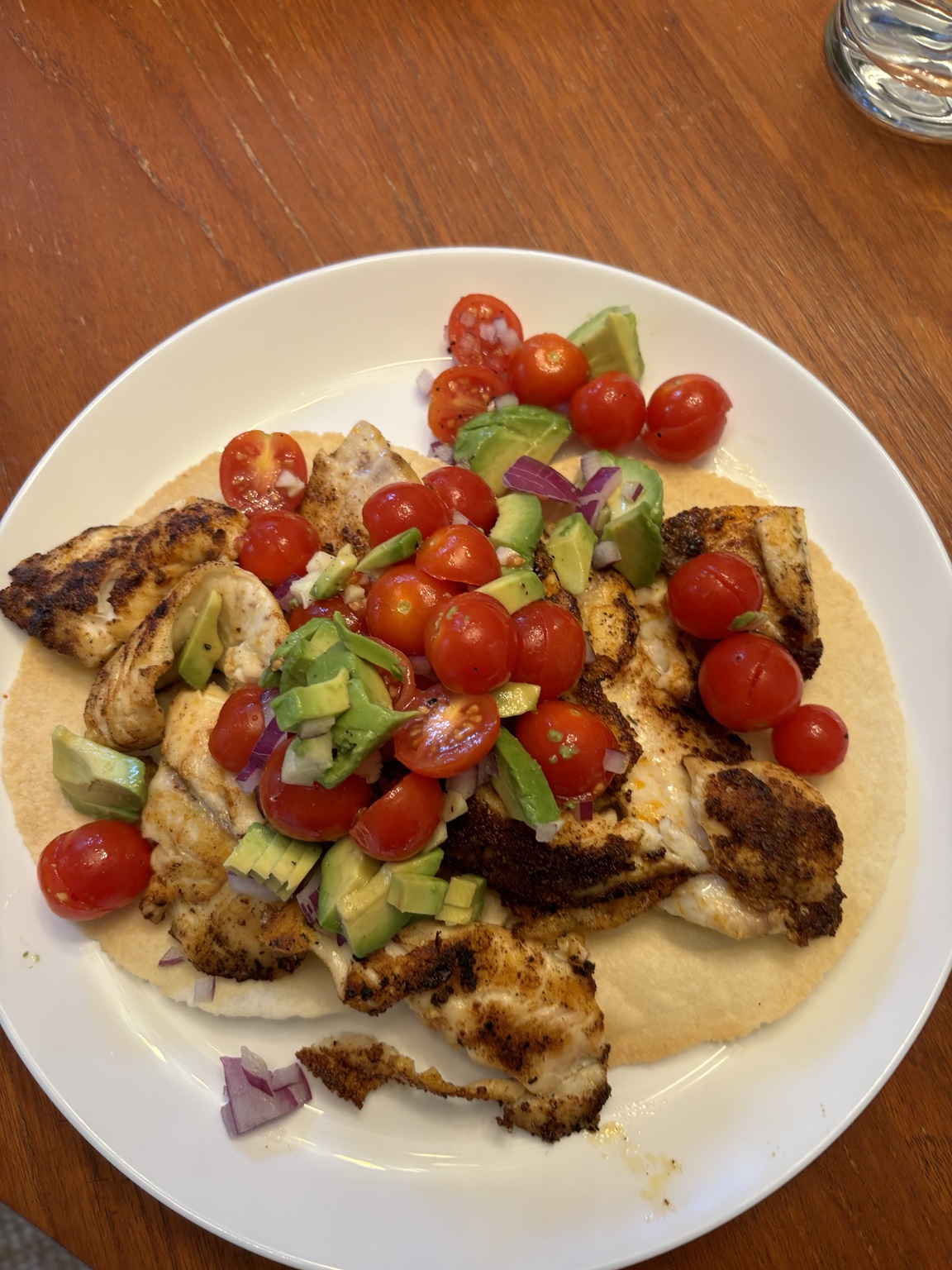 Porgy fish tacos with avocado and tomatoes