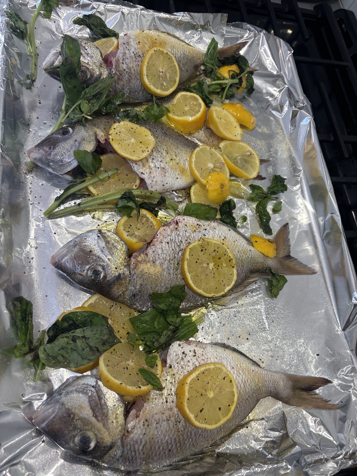 Whole porgies prepared with lemon and herbs